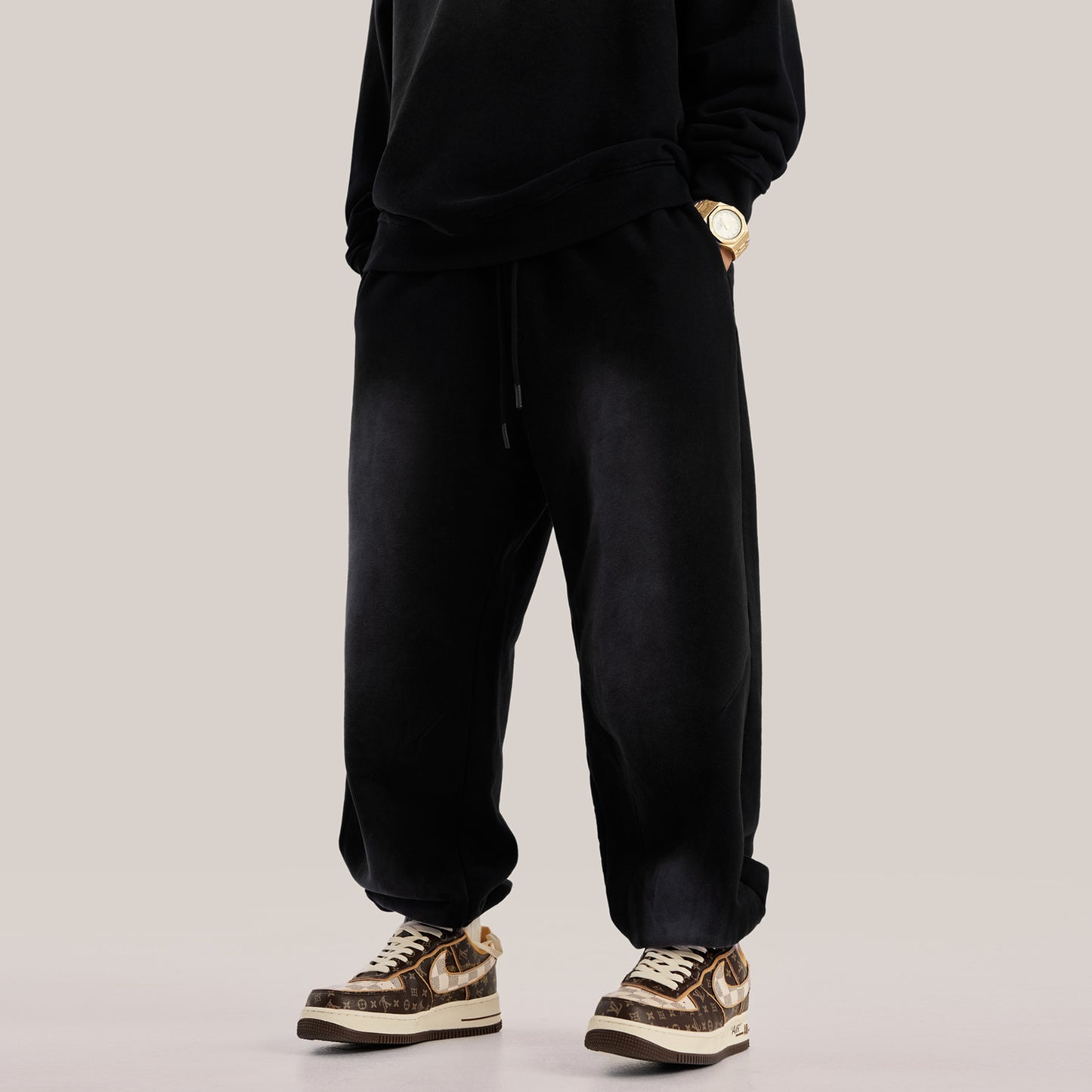Hands in pocket of luxury streetwear black oversized pants baggy sweatpants streetwear aesthetic