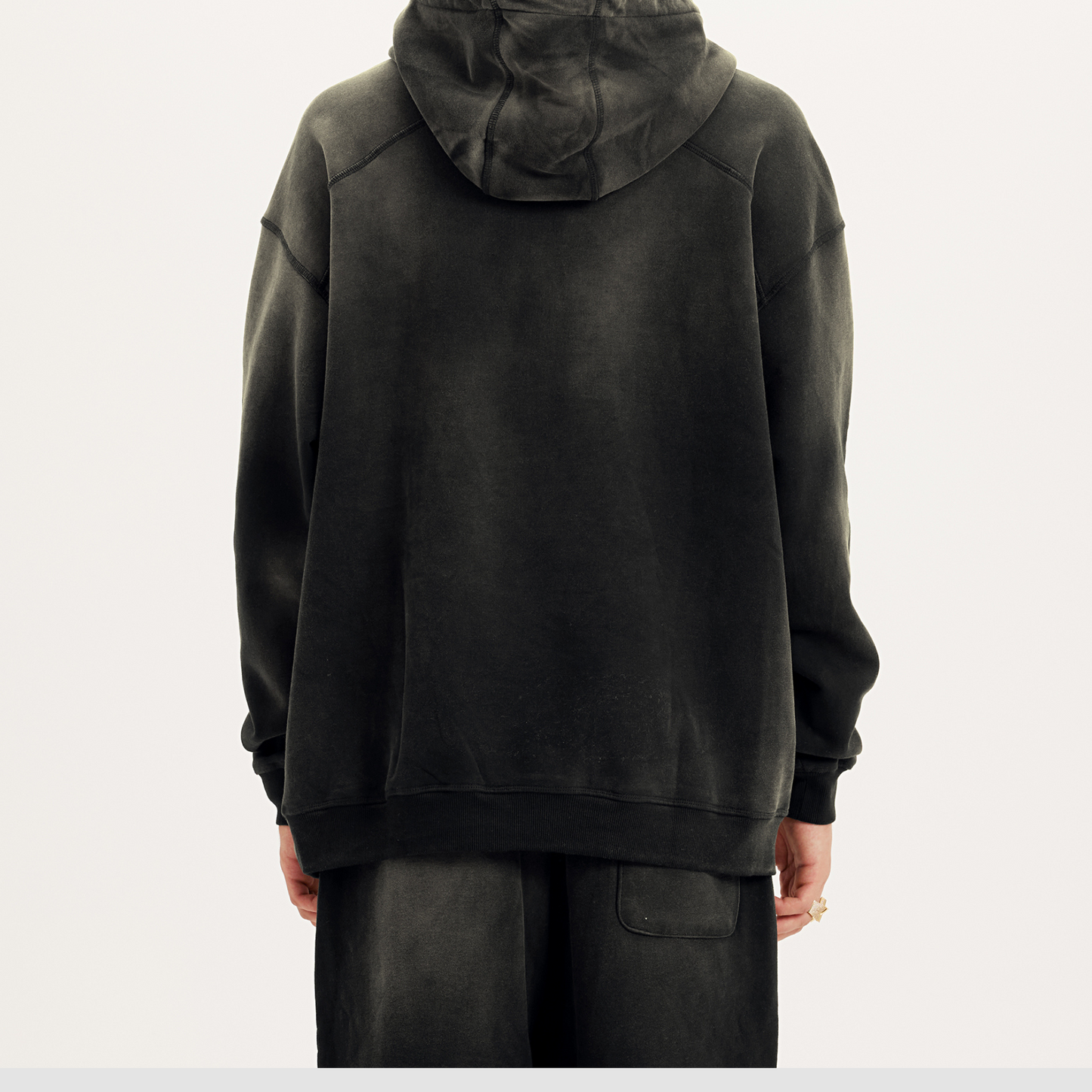 back side of dyed black streetwear hoodie; drop shoulder black hoodie oversized