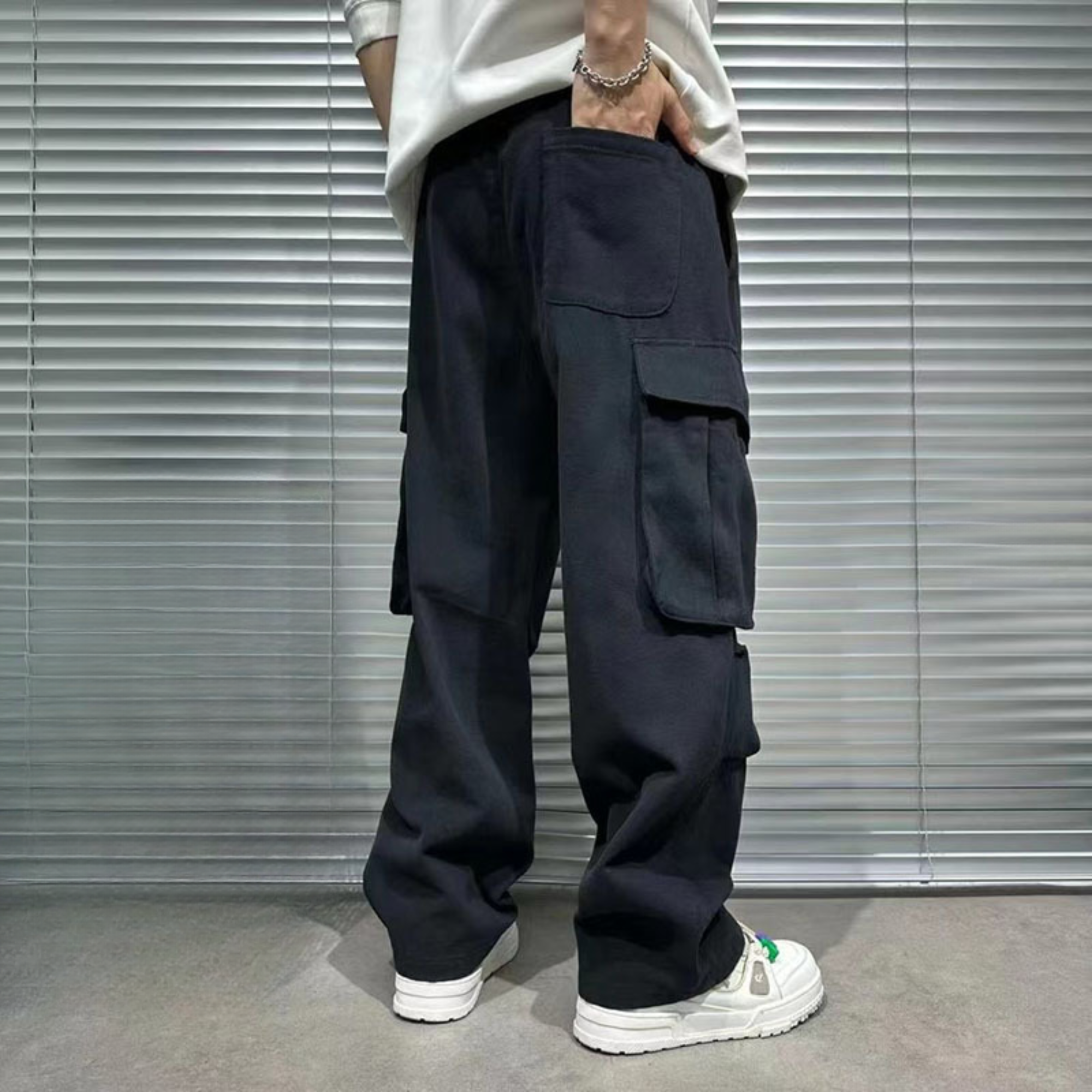 back of black cargo pants for men, model's hand in back pocket
