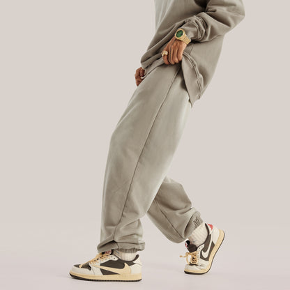 model showing side of beige streetwear pants, baggy pants luxury streetwear aesthetic of mens fashion