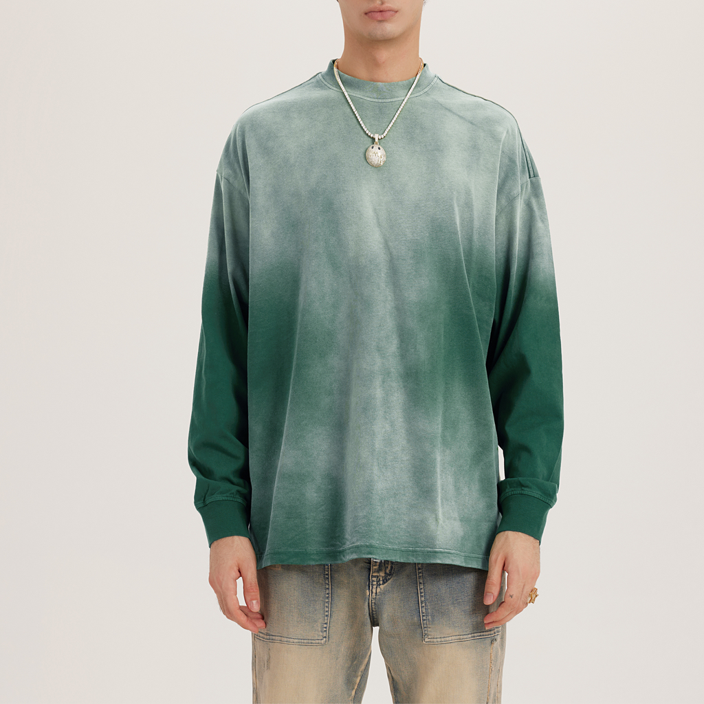 dyed green oversized crewneck mens; model wearing necklace and faded streetwear jeans