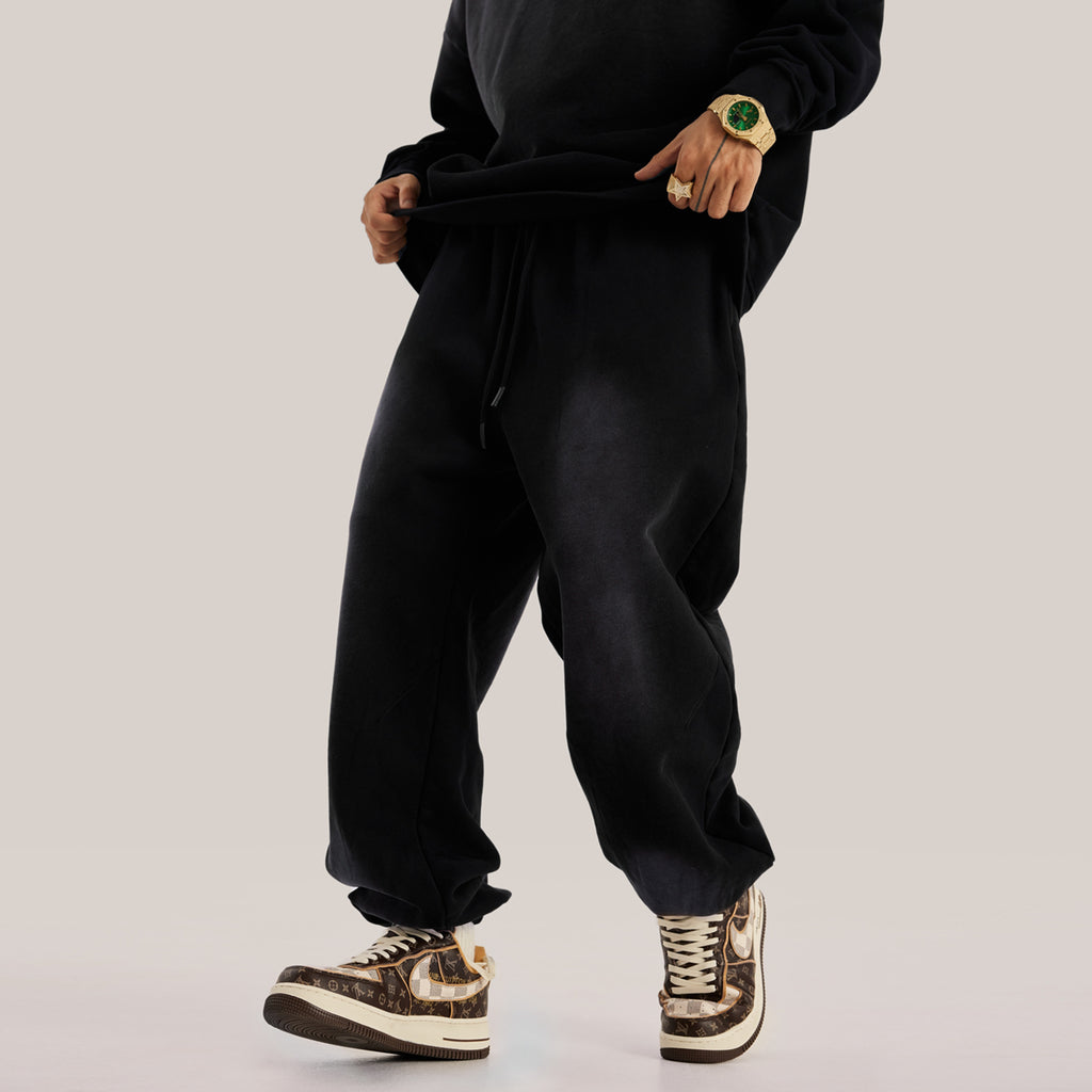 Luxury streetwear black oversized pants in baggy sweatpants streetwear aesthetic pose