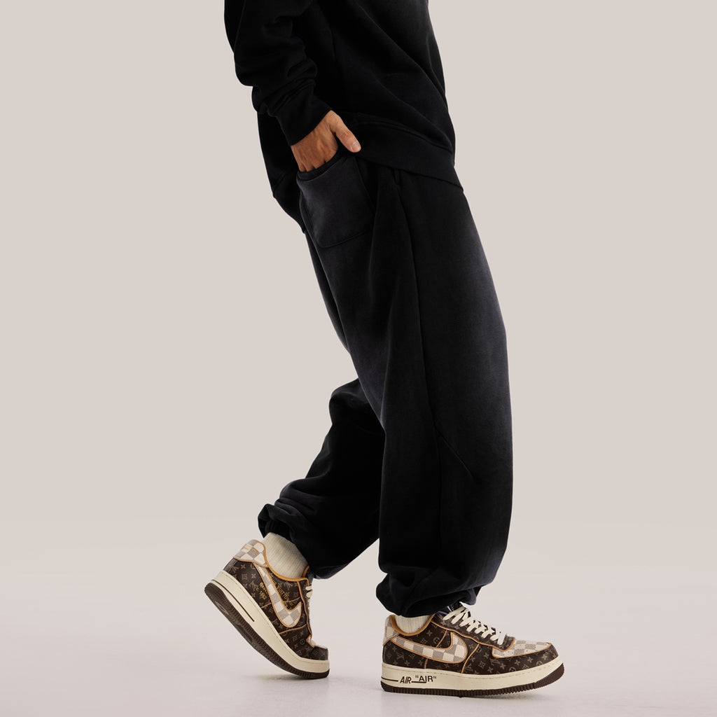 Side of luxury streetwear black oversized pants in baggy sweatpants streetwear aesthetic