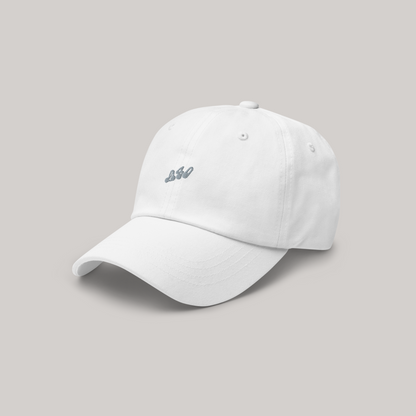 Side angle of white cap hat with 980 silver embroidery in the front center. Made of cotton twill