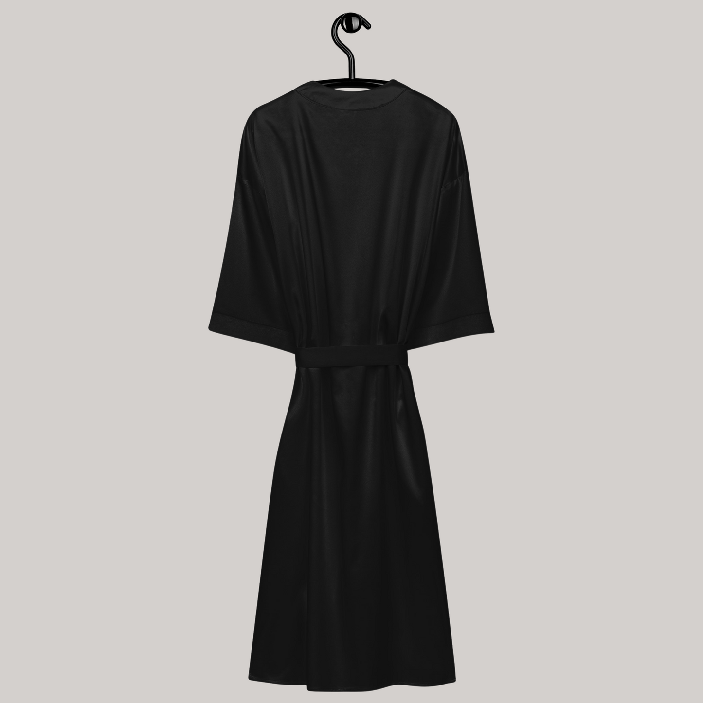 Back side of black satin kimono robe, hanging demonstration. Tied closed. 