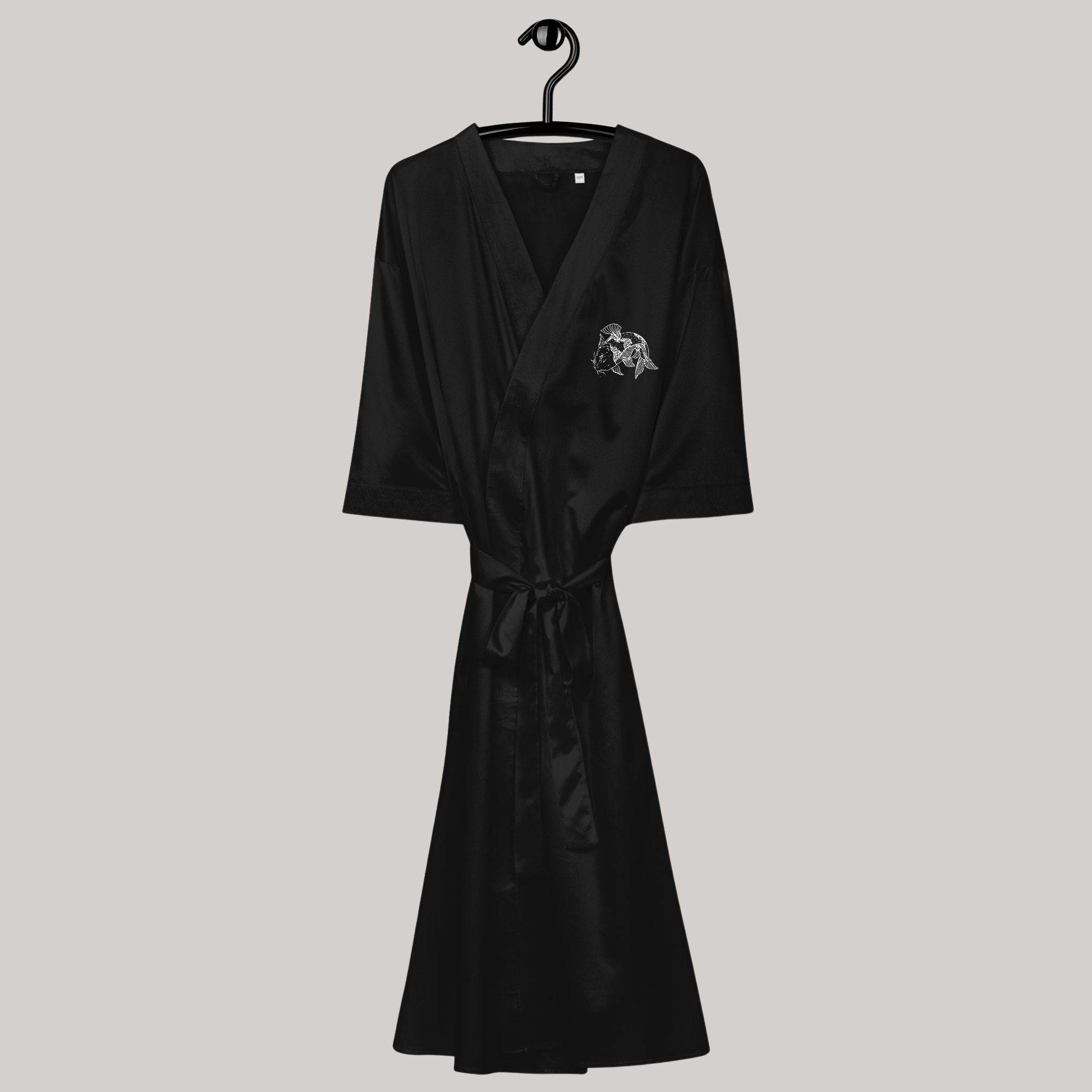 full body view of black satin kimono robe 3/4 sleeves below knee left chest japanese koi fish symbol embroidery avant-garde edgy 