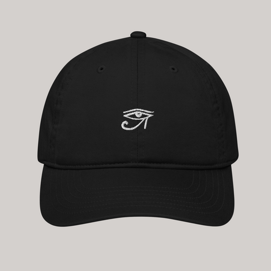 basic black baseball cap hat with eye of horus embroidered patch. simple and minimalistic streetwear headgear accessory. ancient egyptian symbol. refined look